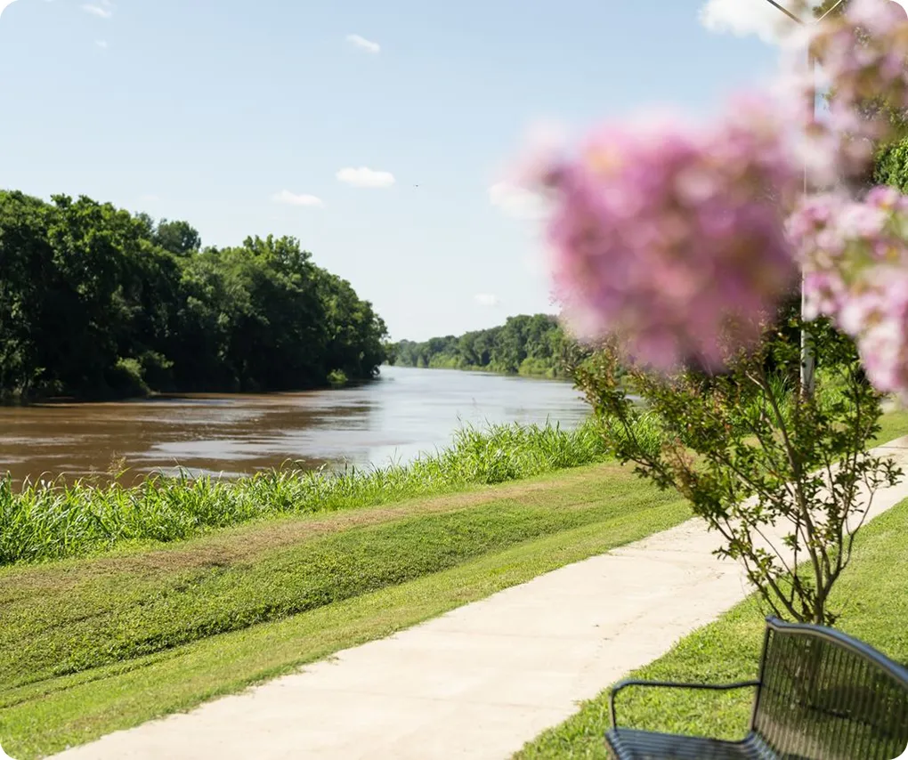 Great Pee Dee River with a riverside path and blooming flowers