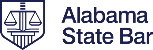 Logo of Alabama State Bar featuring scales of justice inside a shield.