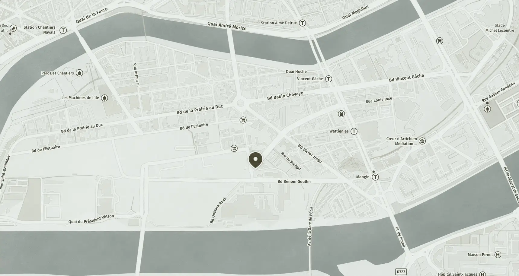 Map showing a section of a city with streets, rivers, transit stations, parks, and a location pin.