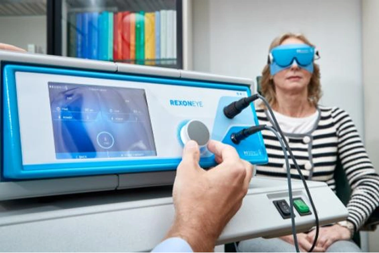 Patient wearing the Rexon-Eye mask during quantum molecular resonance treatment