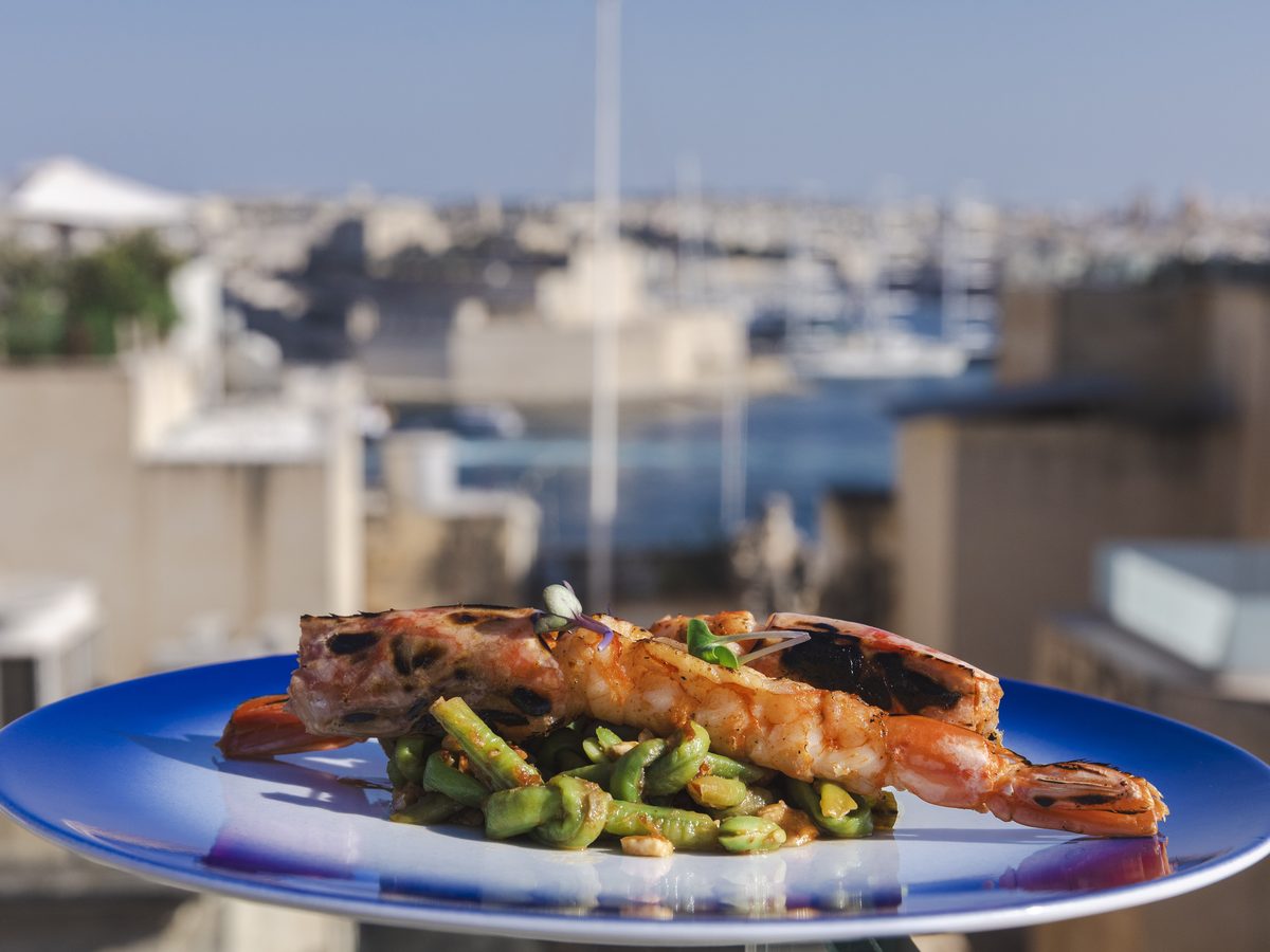 Grilled prawn three-bean salad with the Grand Harbour behind, Anaalā Valletta