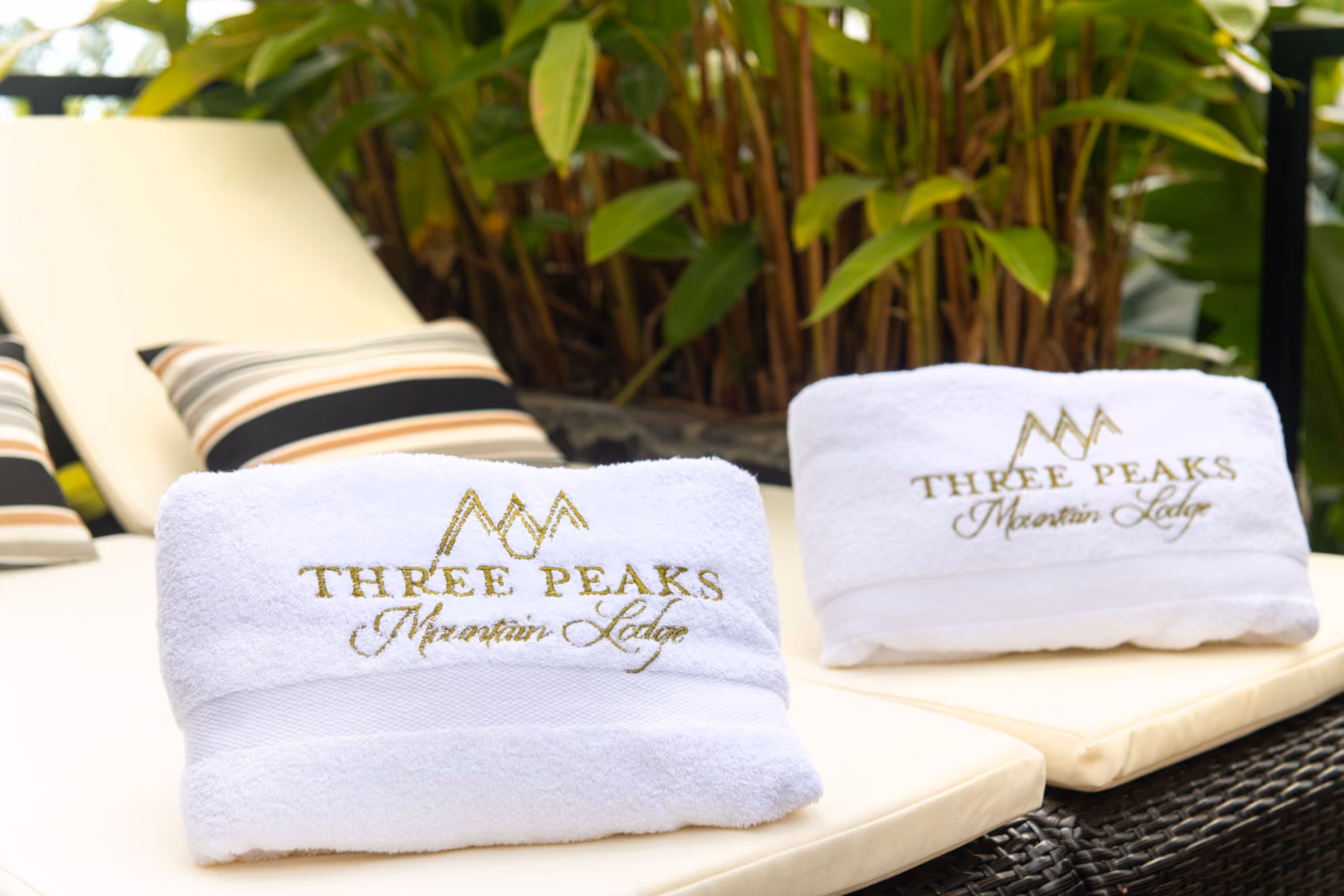 Two custom engraved pillows near the pool