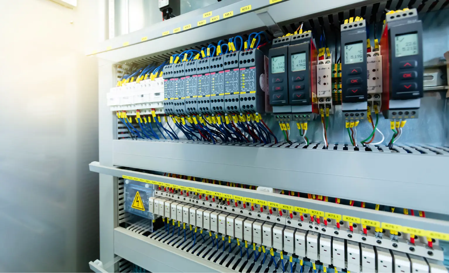 Corner section of an uncovered electric control panel unit