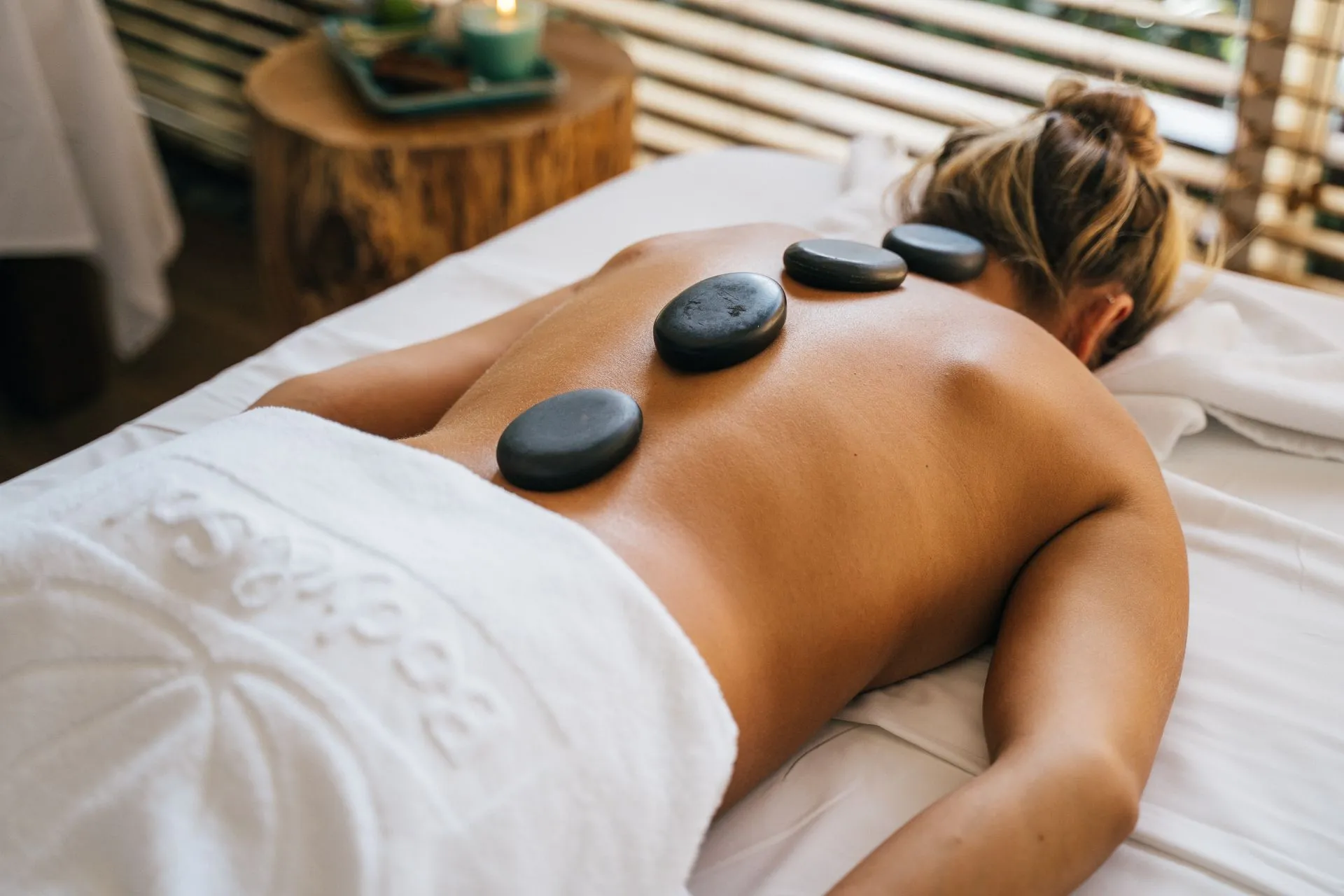 Hot stone massage with warmed basalt stones at DASA Spa on the San Antonio Riverwalk