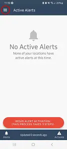 Mobile app screen displaying 'No Active Alerts' message with a bell icon and text indicating no locations have active alerts, a red button labeled 'BEGIN ALERT ACTIVATION! (THIS PROCESS TAKES 5 STEPS)', and navigation icons for Alerts, Updated status, and Activate at the bottom.