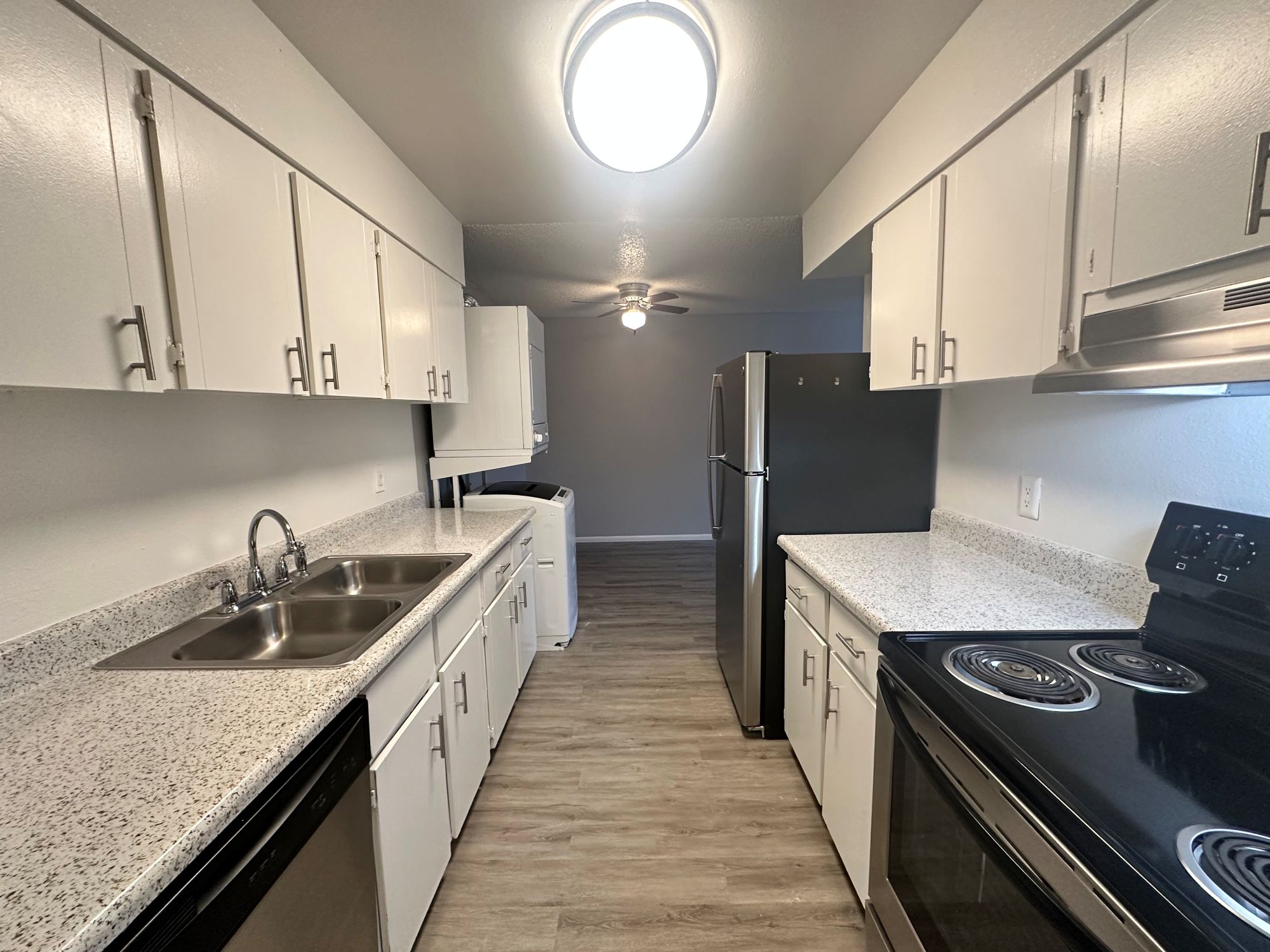 Kitchen with stainless steel appliances and view of washer and dryer and dining area