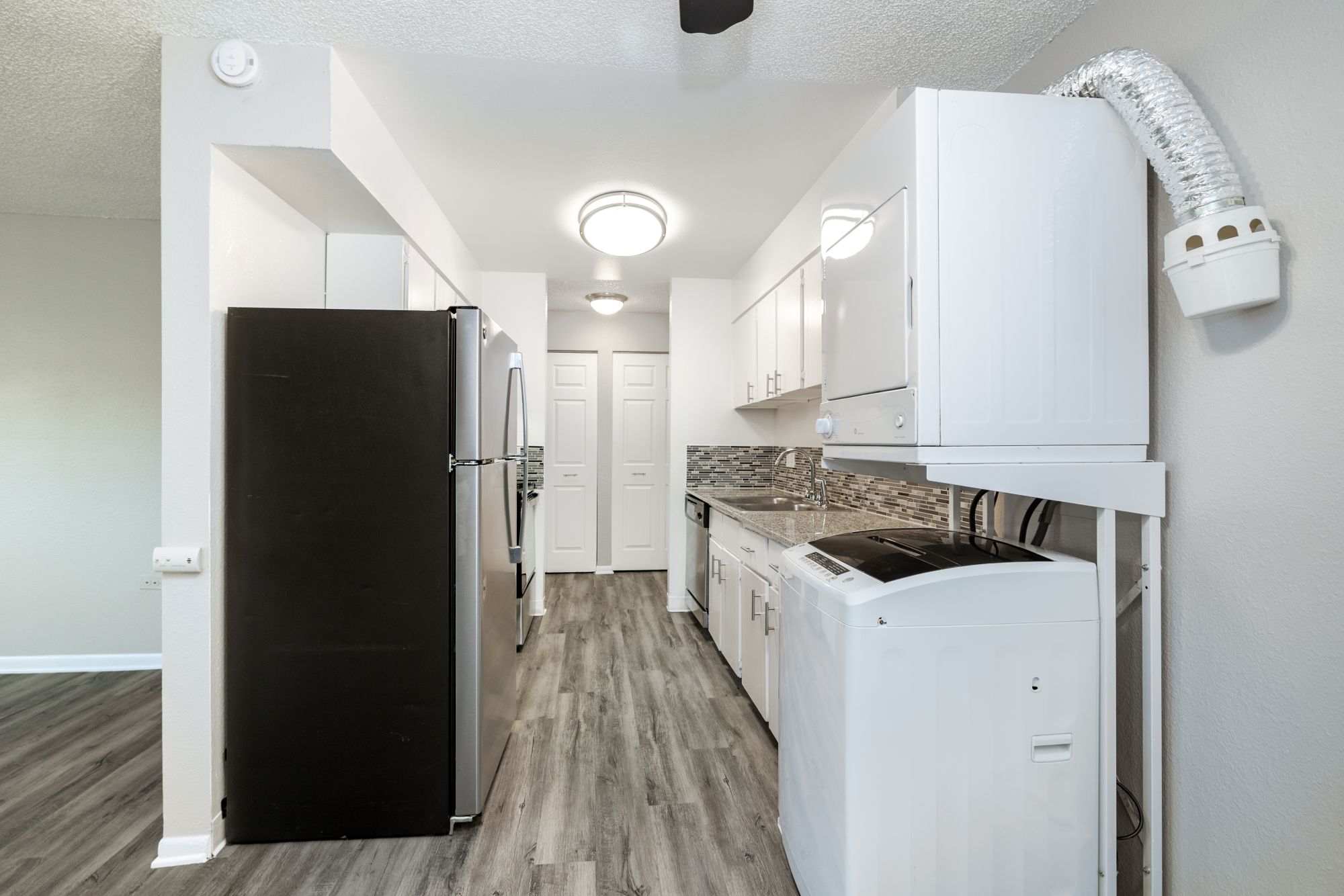 Kitchen with white cabinets and stainless steel appliances