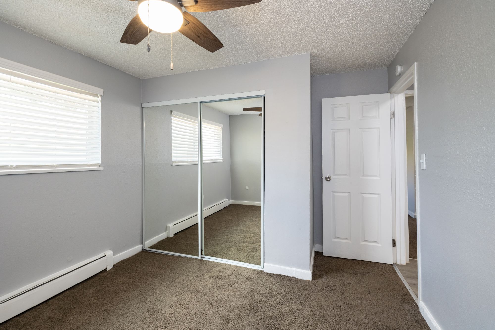 Bedroom with Mirrored Closet