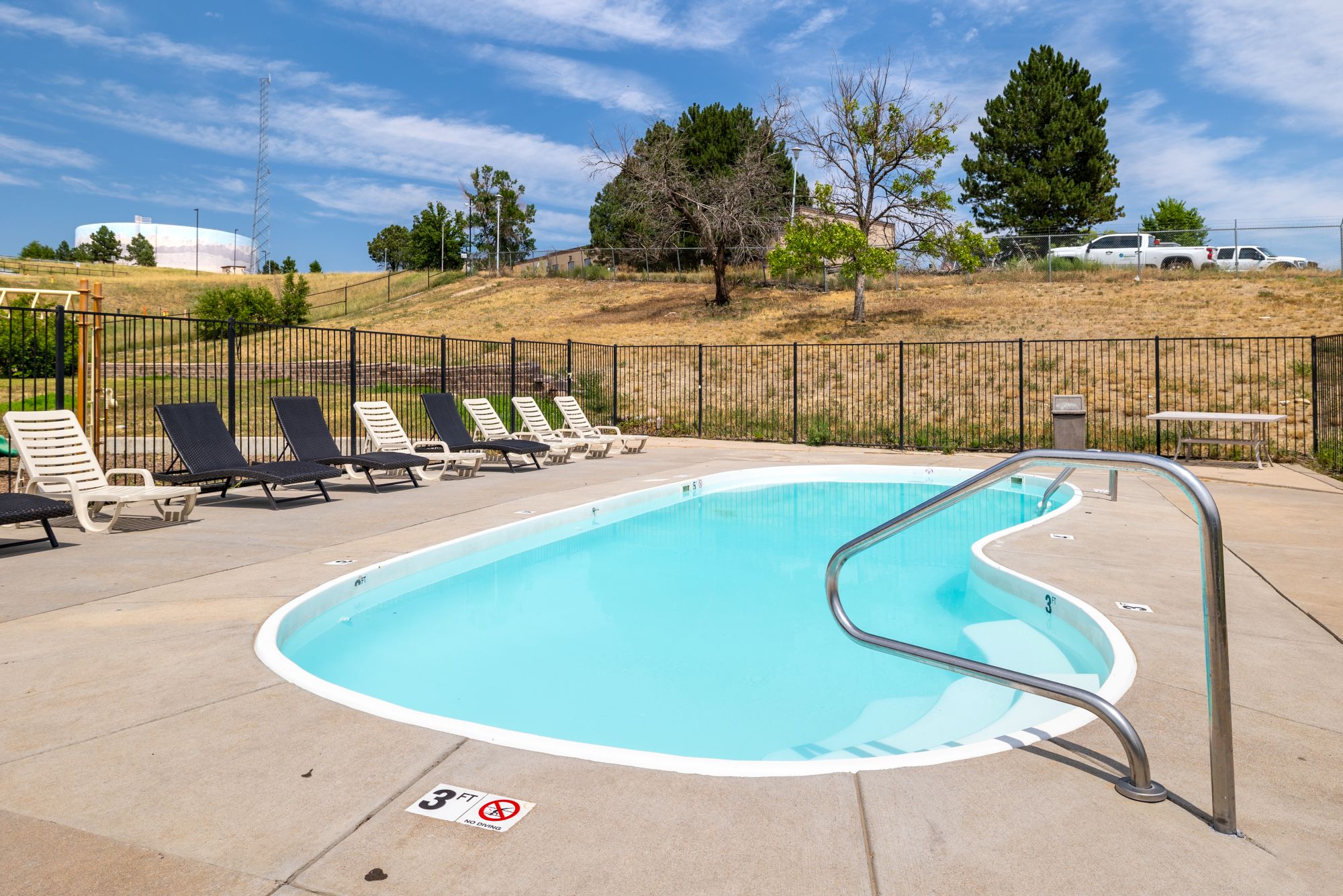 Swimming pool with chairs