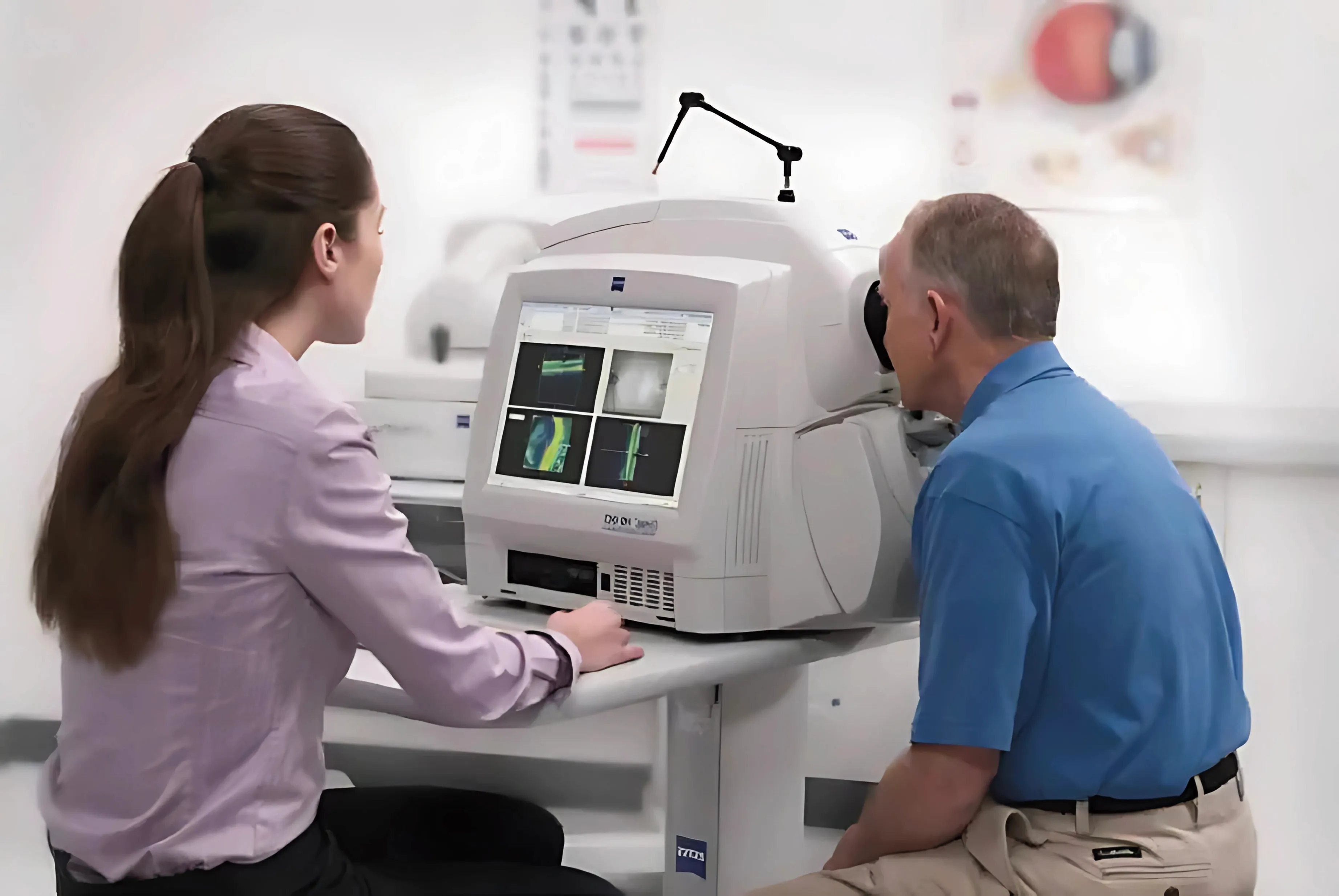 Patient undergoing OCT retinal imaging with a clinician