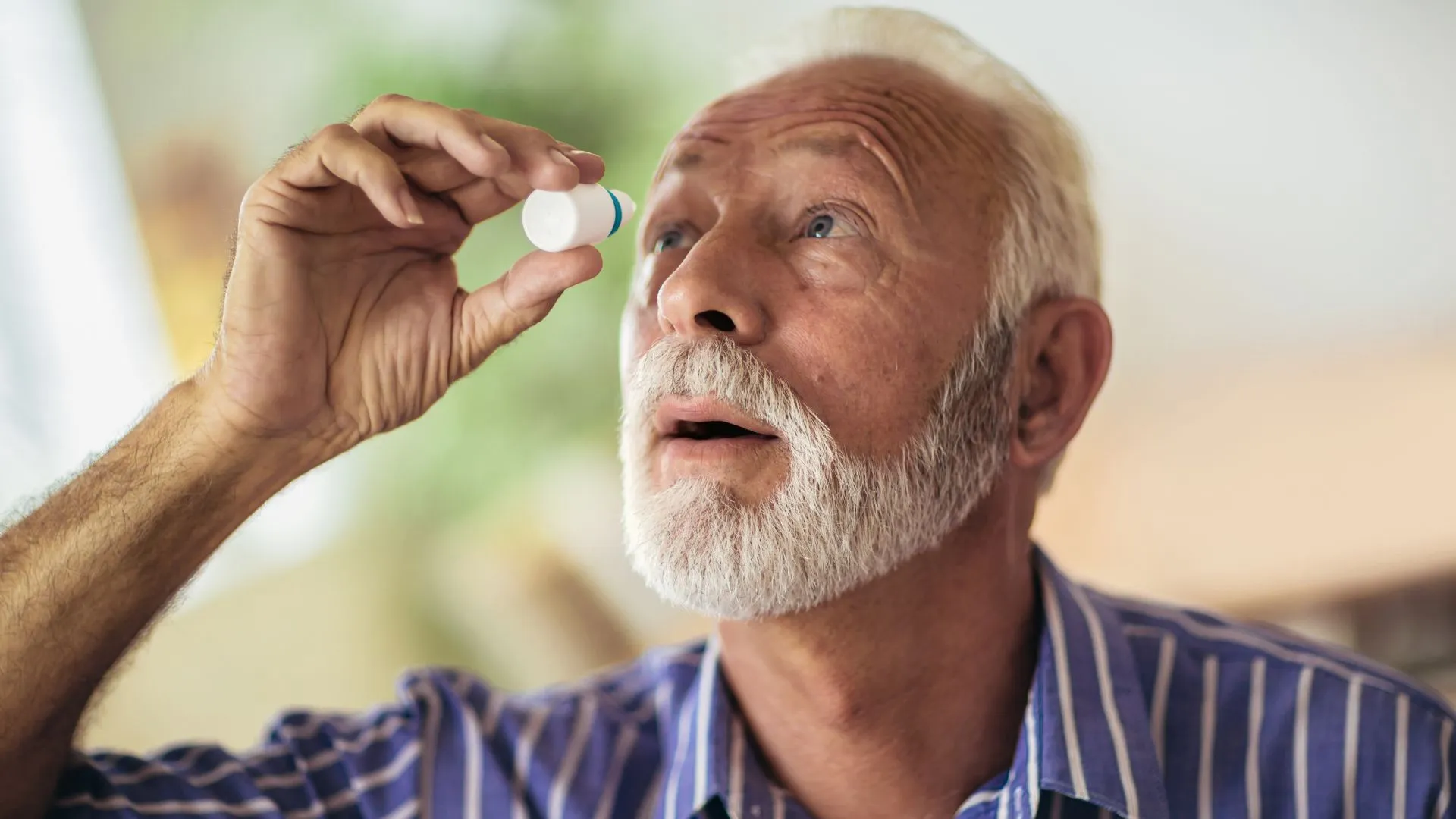 Man applying eye drops
