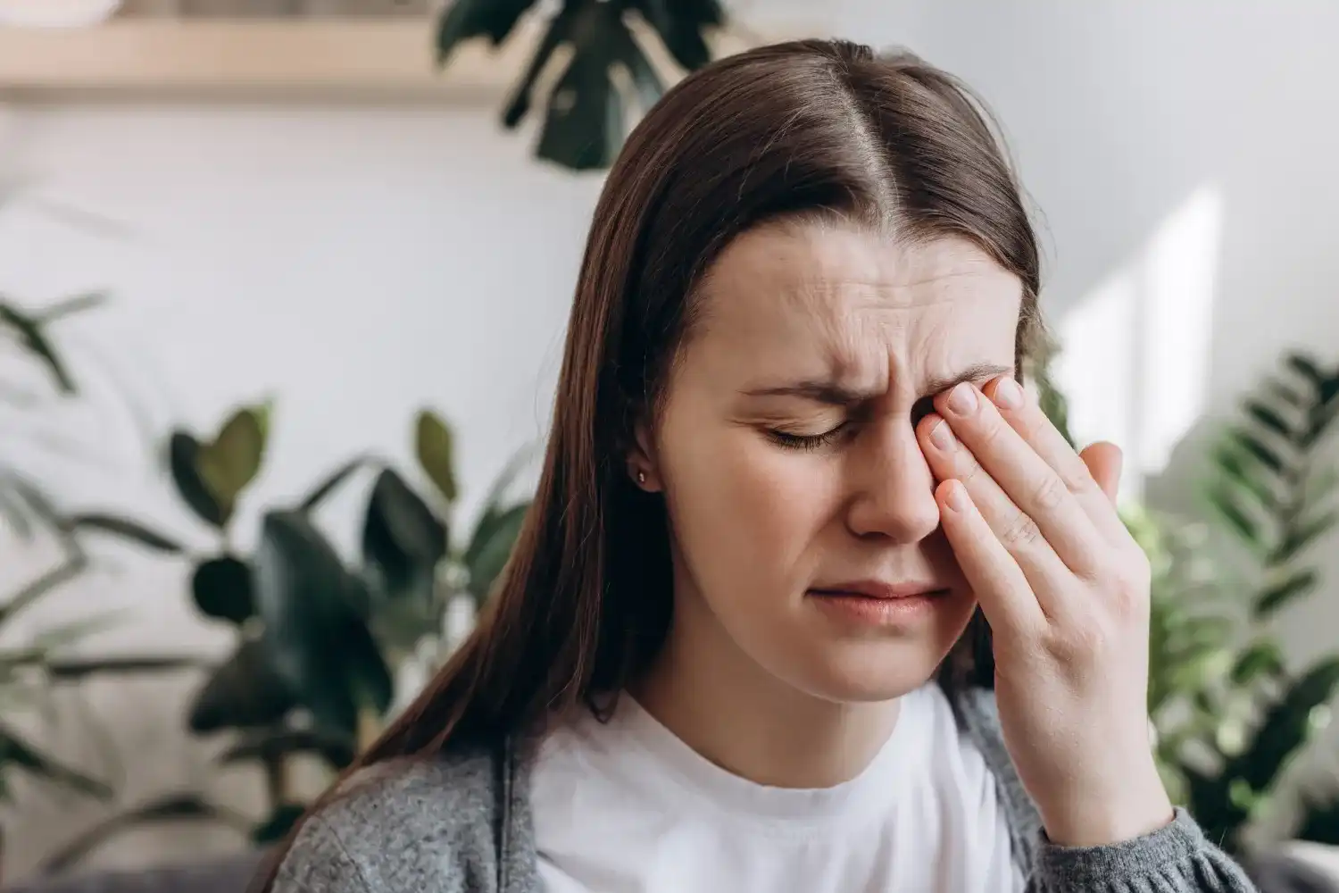 Patient experiencing eye pain and discomfort
