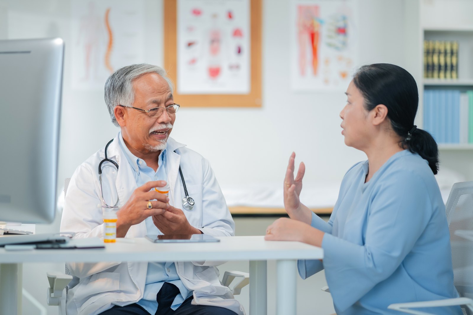 Clinician reviewing an ocular surface assessment with a patient before recommending adjunctive Ayurvedic eye therapy