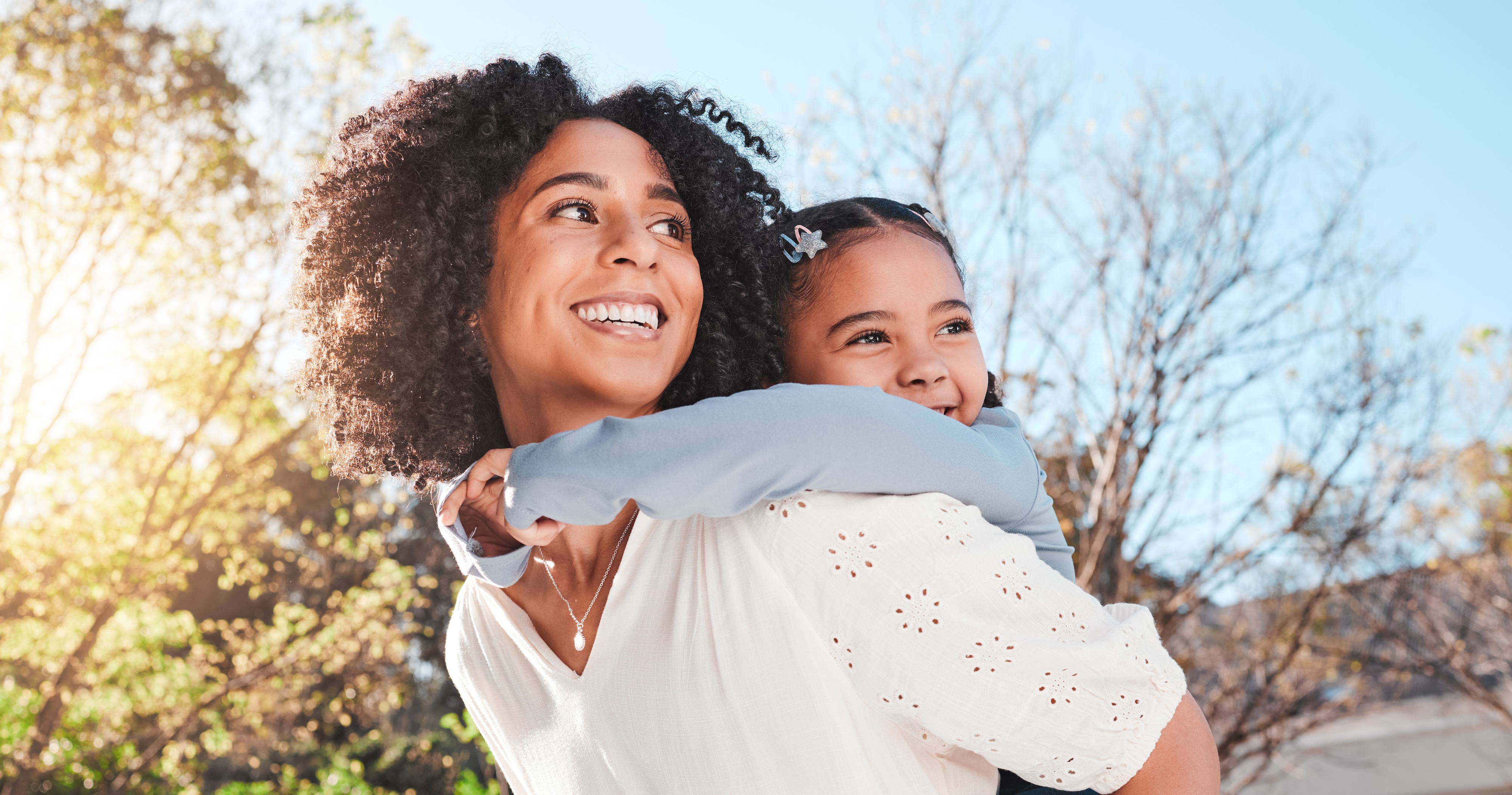 Woman and child on back stock image