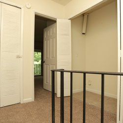 Landing at top of stairs with closet