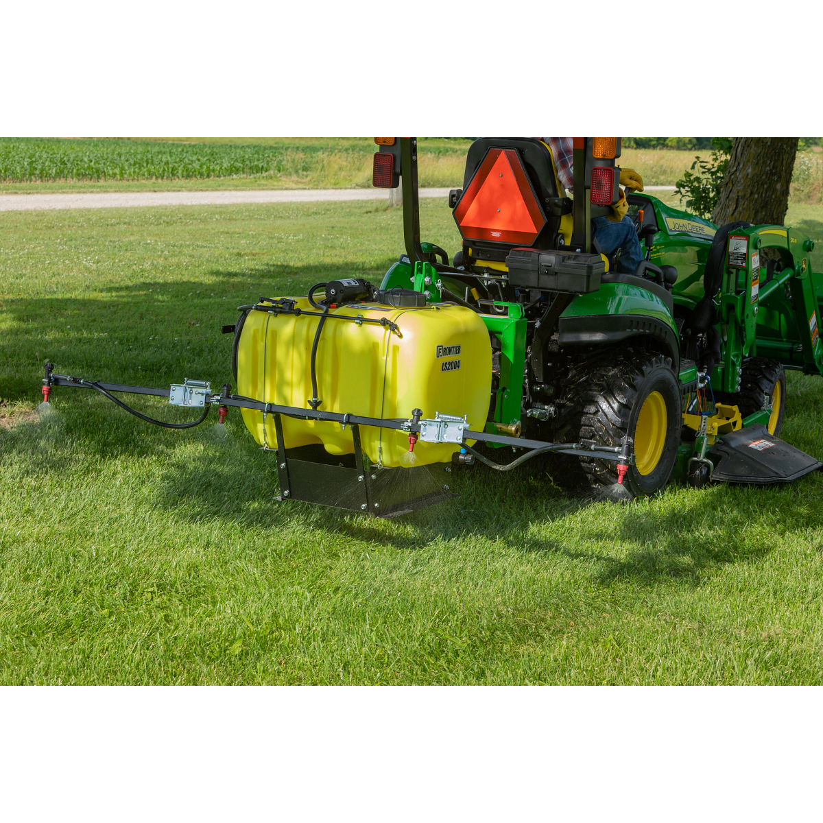 Frontier LS2004 3-Point Mounted Liquid Sprayer on a tractor in the field