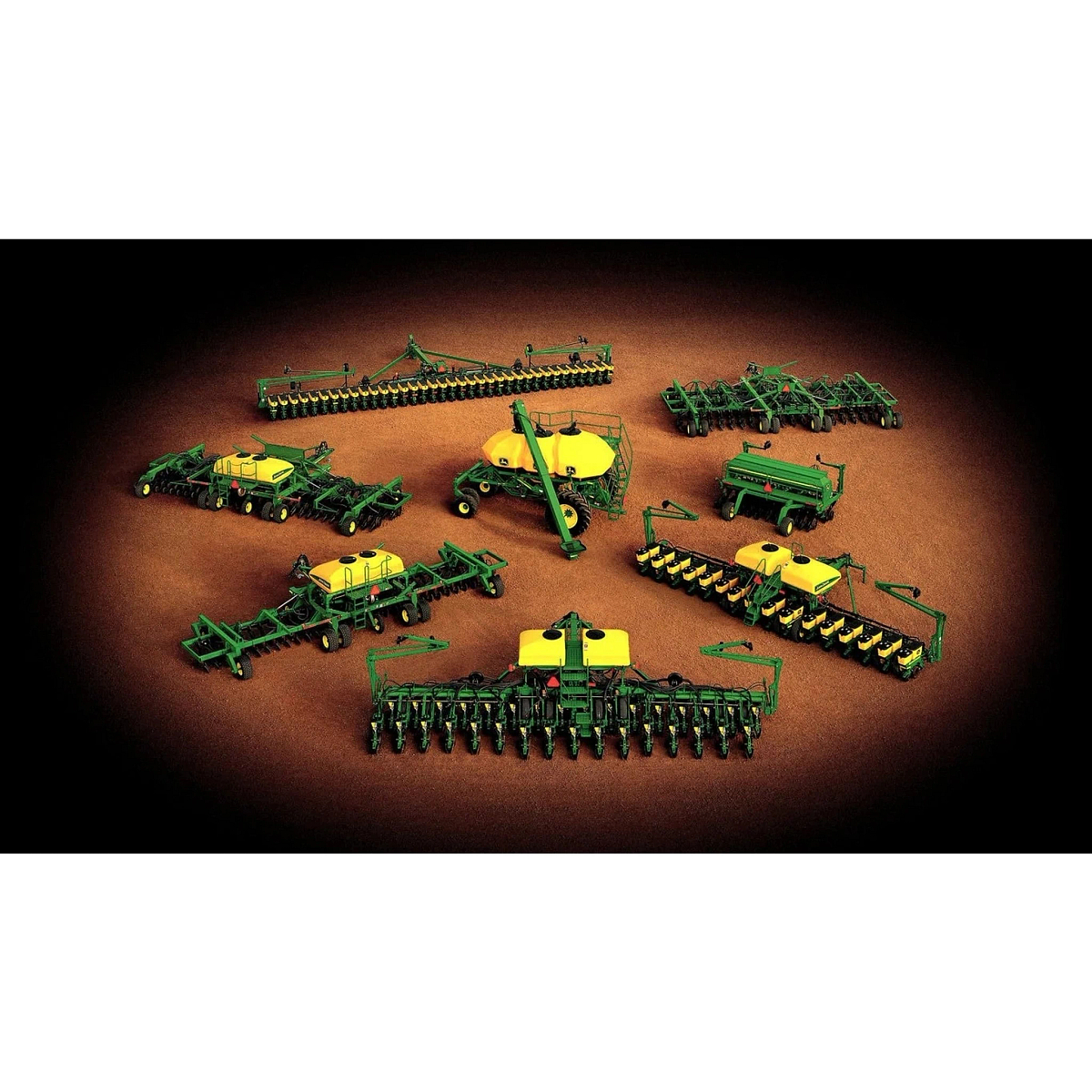 Eight John Deere planting and seeding machines on a brown and black background