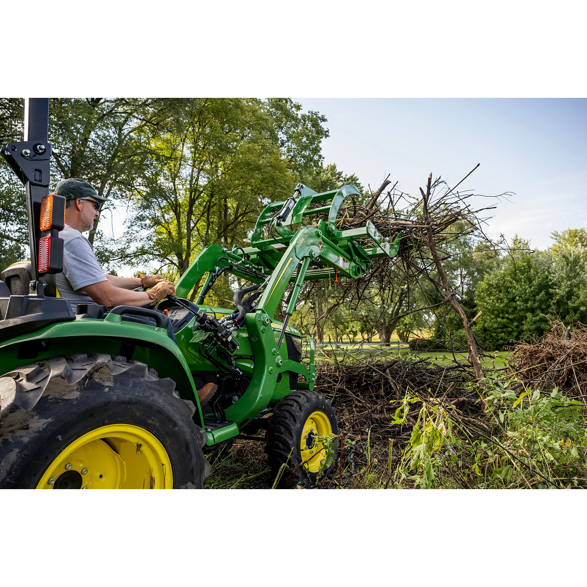 Utility Tractor with Root Grapple with brush