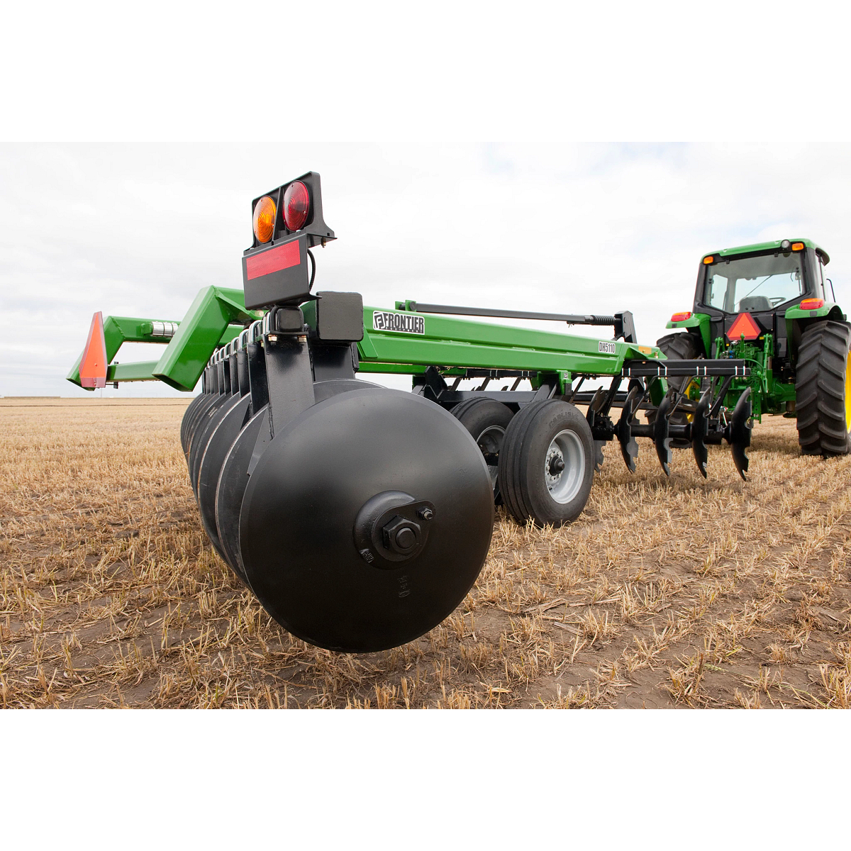 Close up view of DH5110 Disk Harrow on 7230 Tractor in field