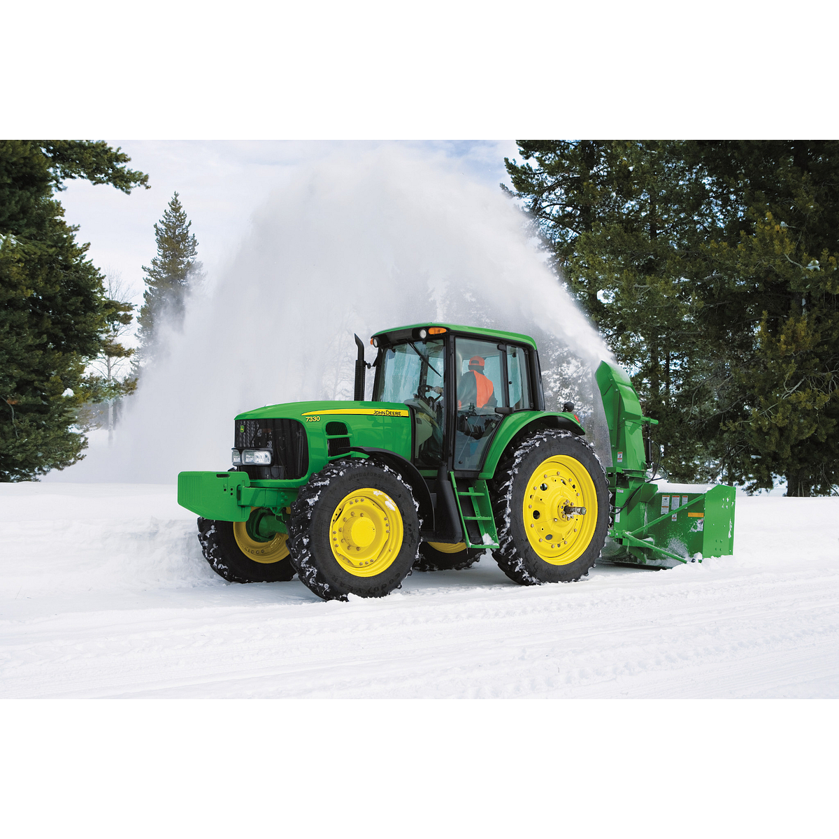 Blowing snow on a driveway using a SB1309R Snowblower on a 7330 Tractor