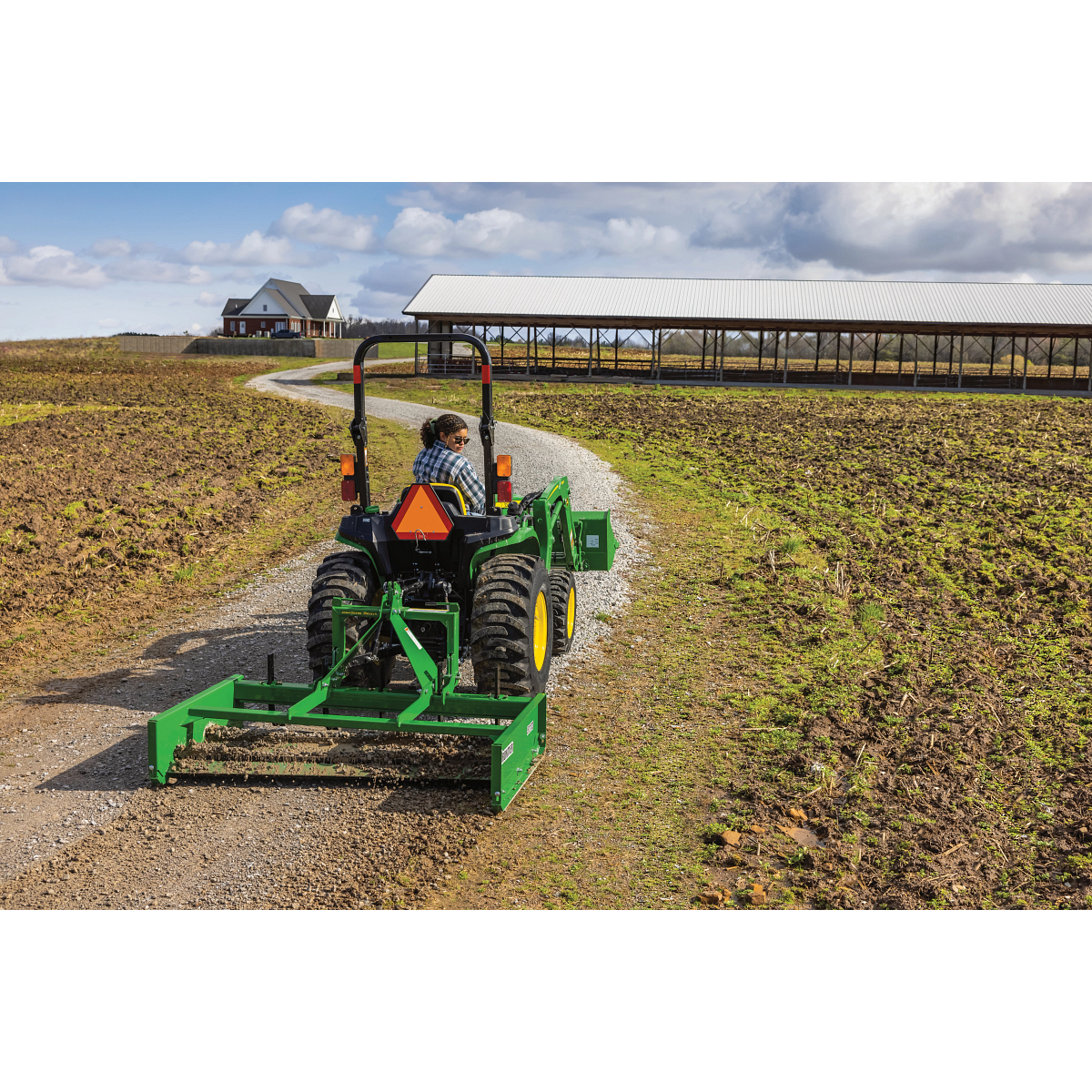 LP2172 Land Plane on 3038E Tractor grading gravel in field path