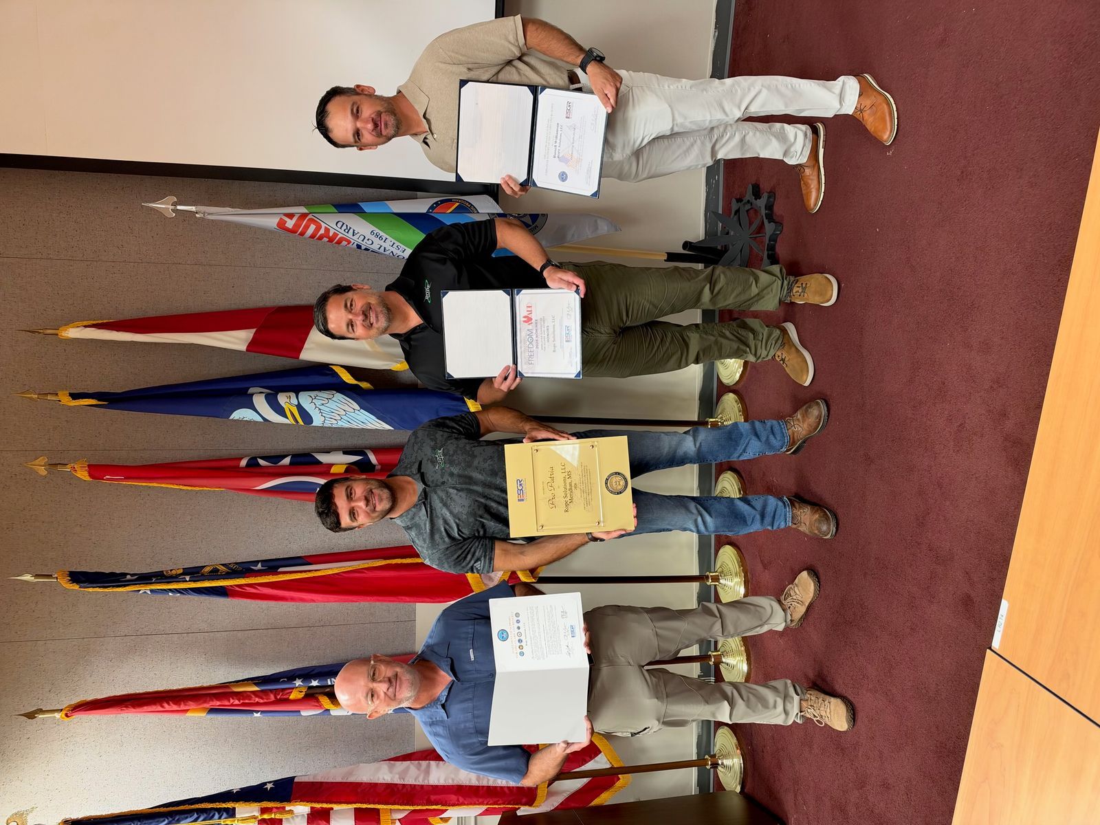 ROPE teammates holding ESGR award certificates