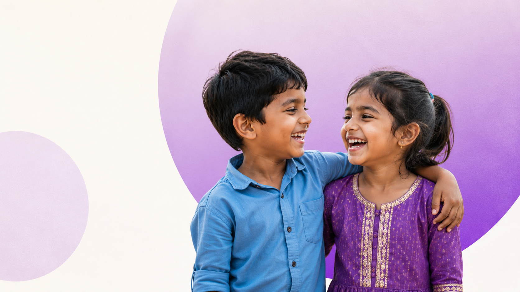 Two smiling children outdoors