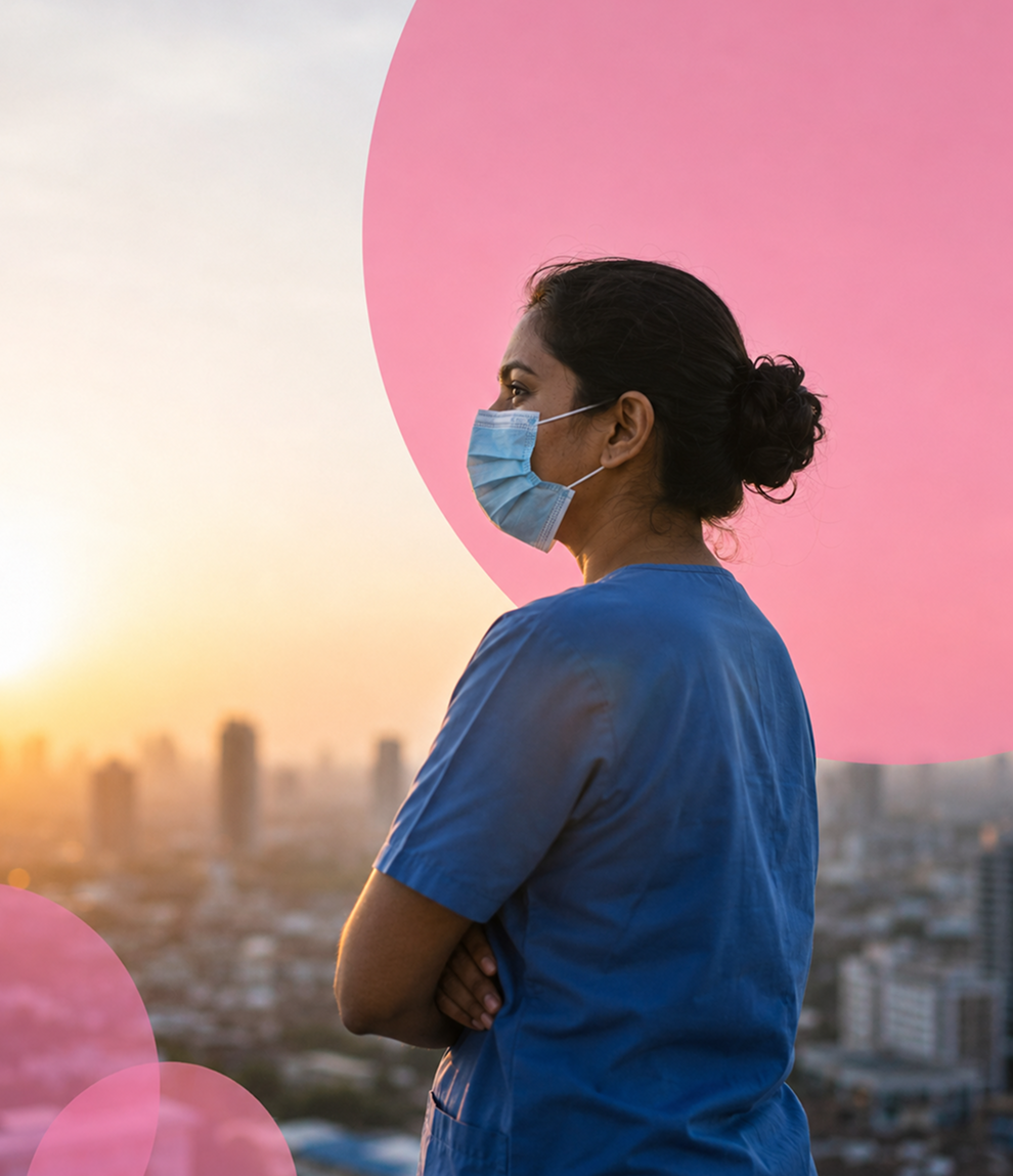 Healthcare worker looking out at a city during the pandemic response