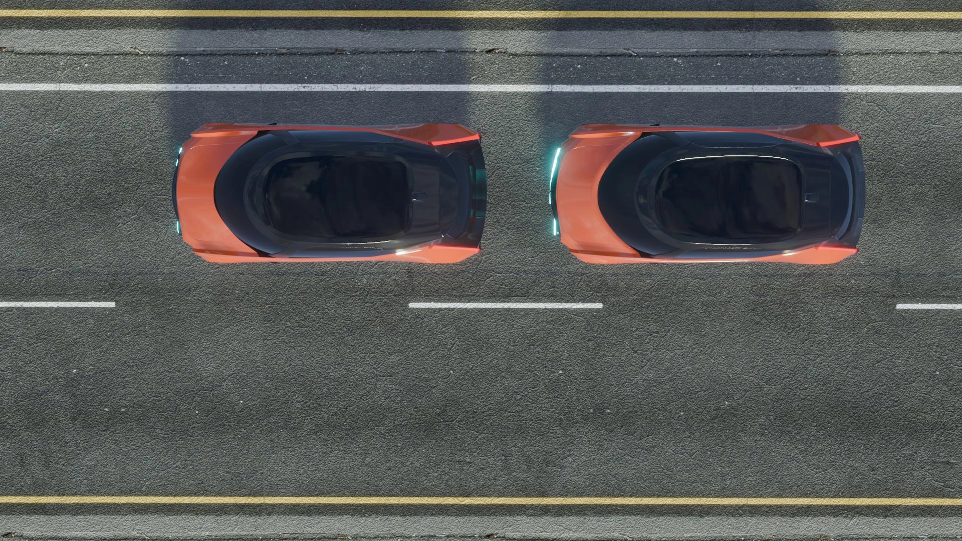 Top-down view of two modern orange cars with black roofs parked side by side on a road.