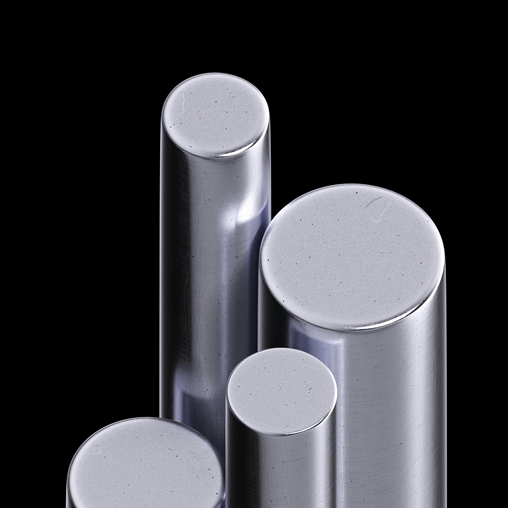 Close-up of several smooth, reflective silver metal cylinders against a black background.