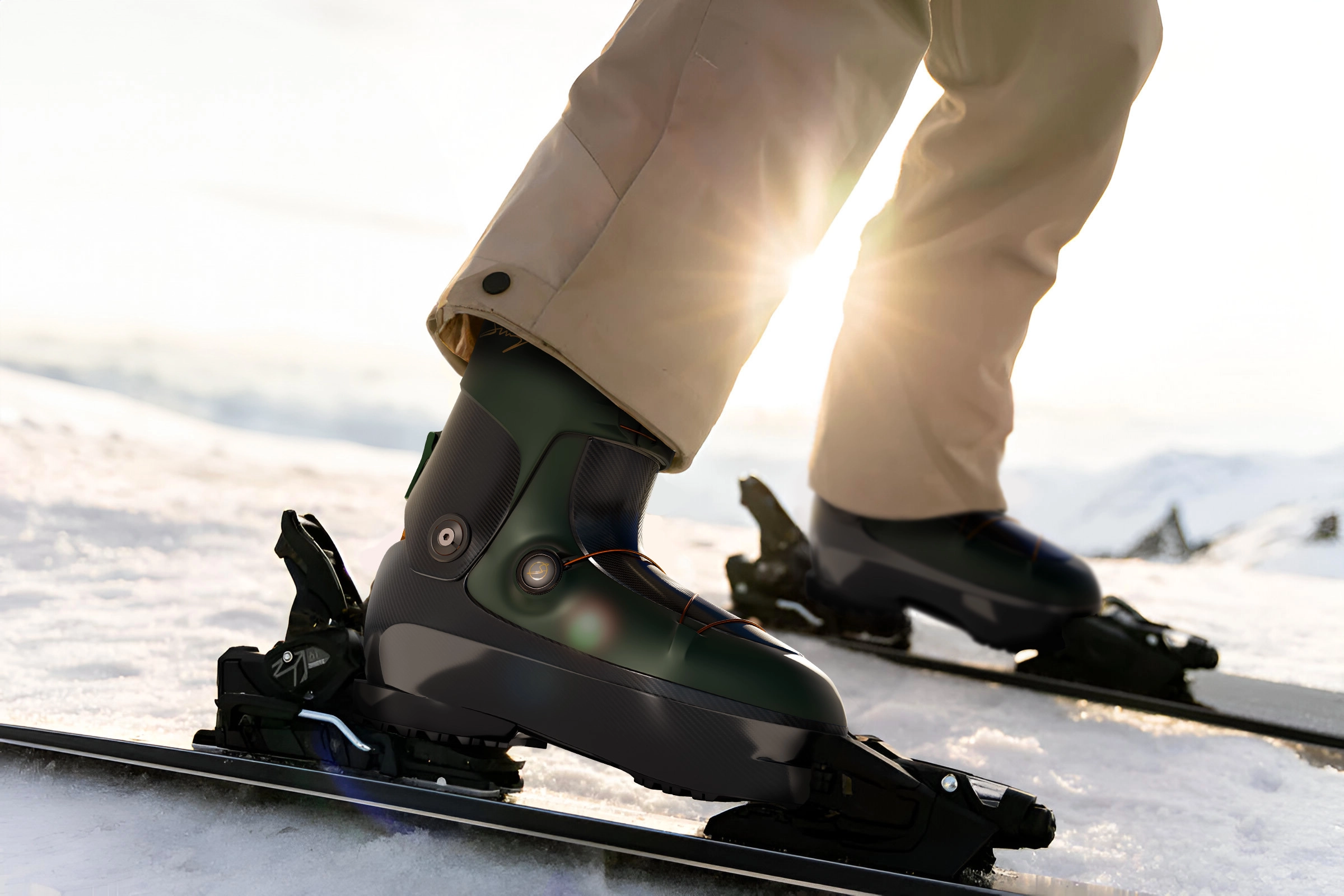Close-up of ski boots fastened to skis on snow with sun shining in background.