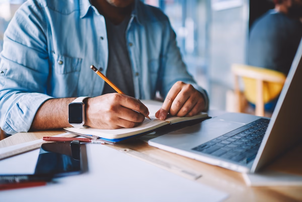Man writing checklist