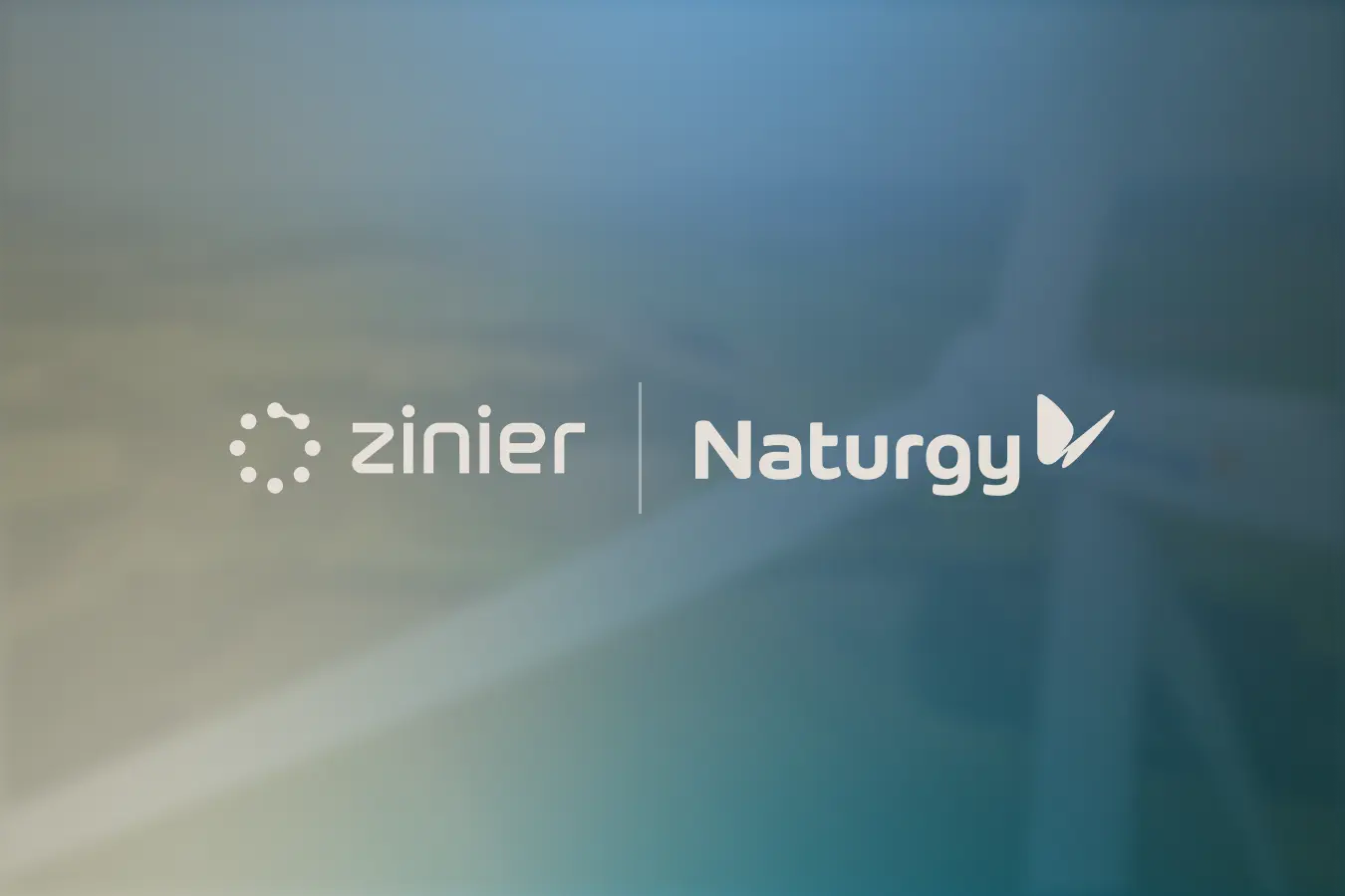 Logos de Zinier et Naturgy côte à côte sur un arrière-plan représentant une éolienne