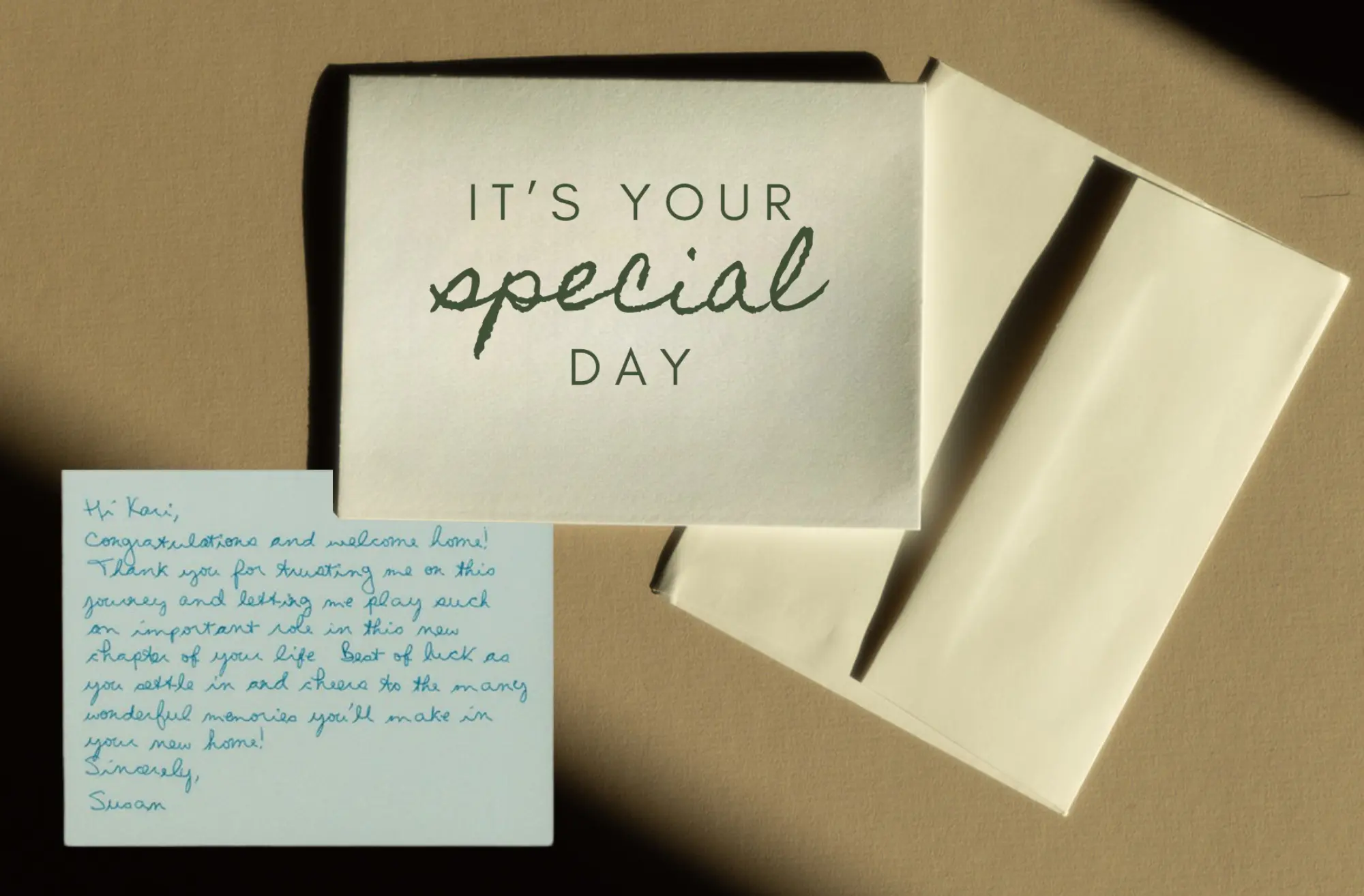 A handwritten card and envelope, with a personal note from an agent to a past client
