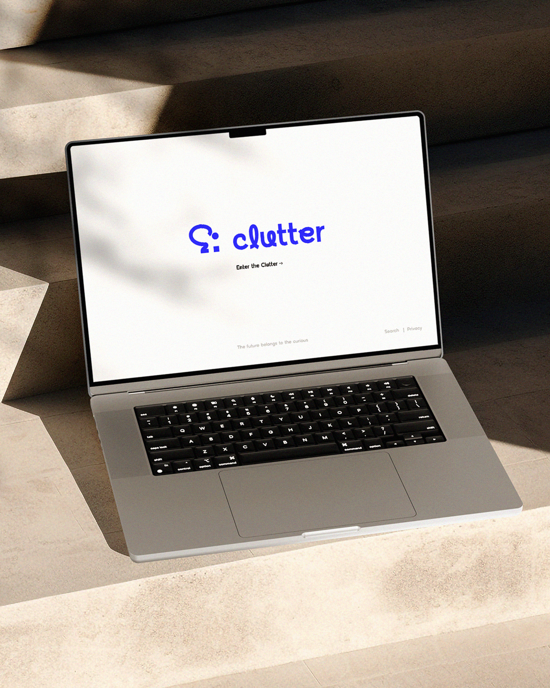 Clutter's home-page mockup on Macbook pro laptop.