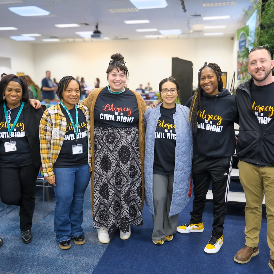 CAUDLeading the Way attendees wearing merch for community building events for K-12 schools