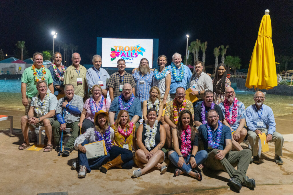 OWAA conference attendees networking and socialising outdoors for a group photo - Sched non-profits