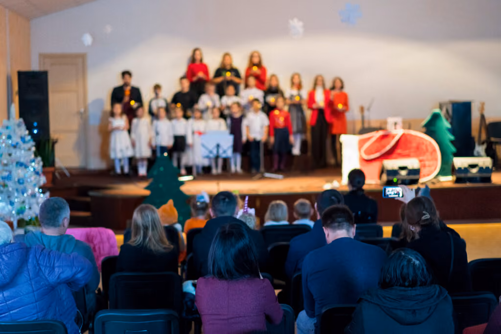 Many parents watching a K-12 schools music performance