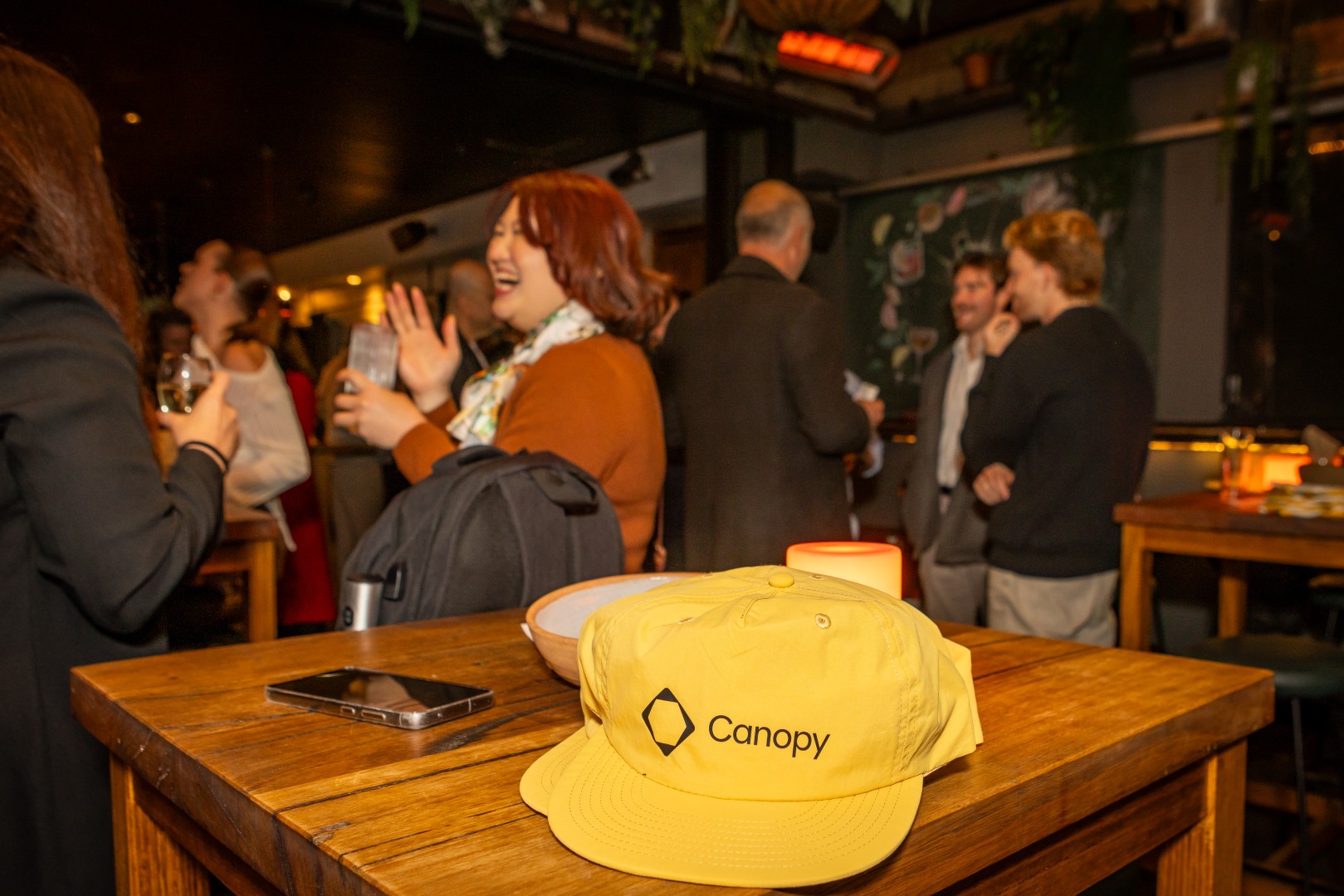 Canopy branded cap on a table at the Canopy launch
