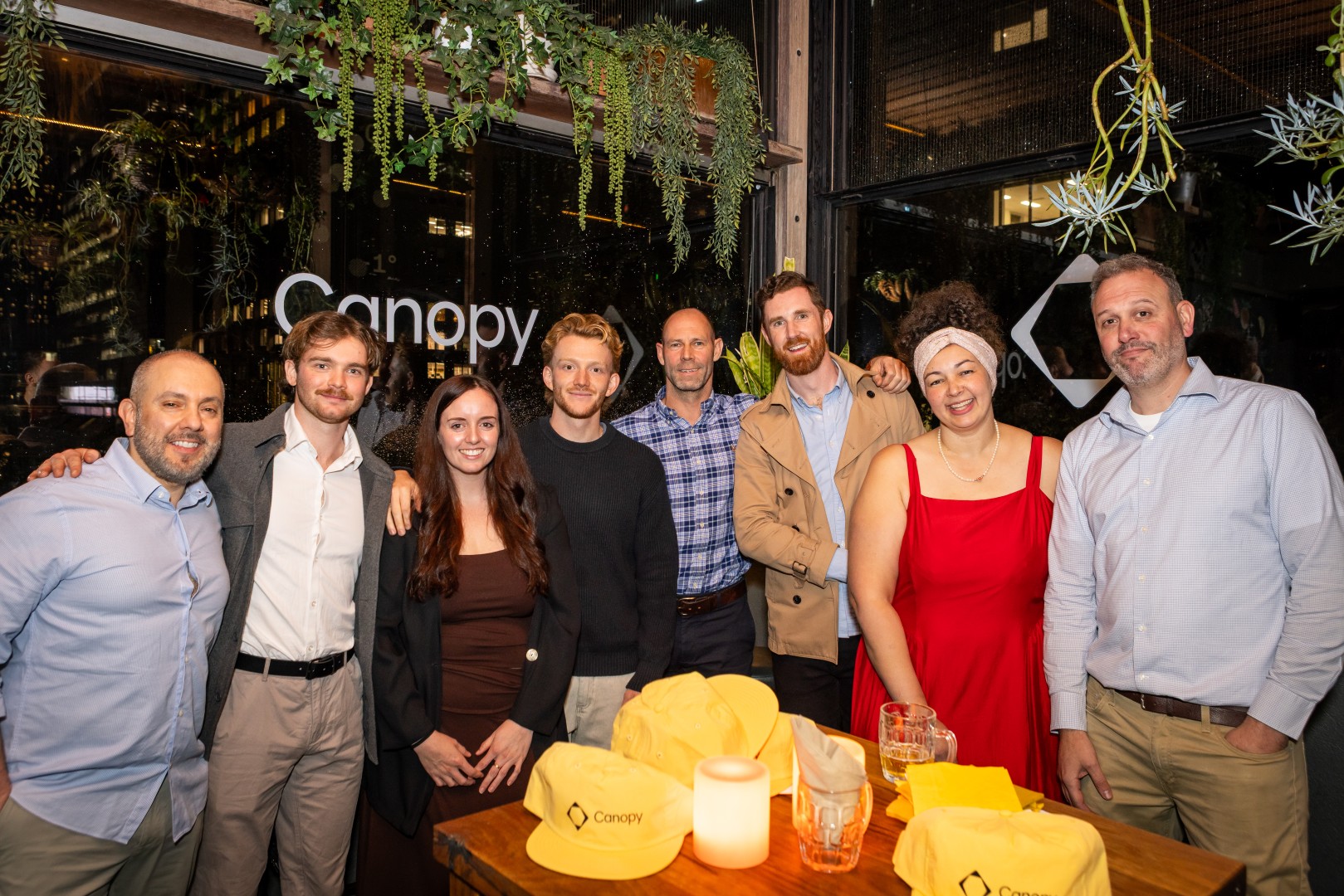 Guests in front of the Canopy logo window at the Canopy launch, Bomba Rooftop Bar, Melbourne