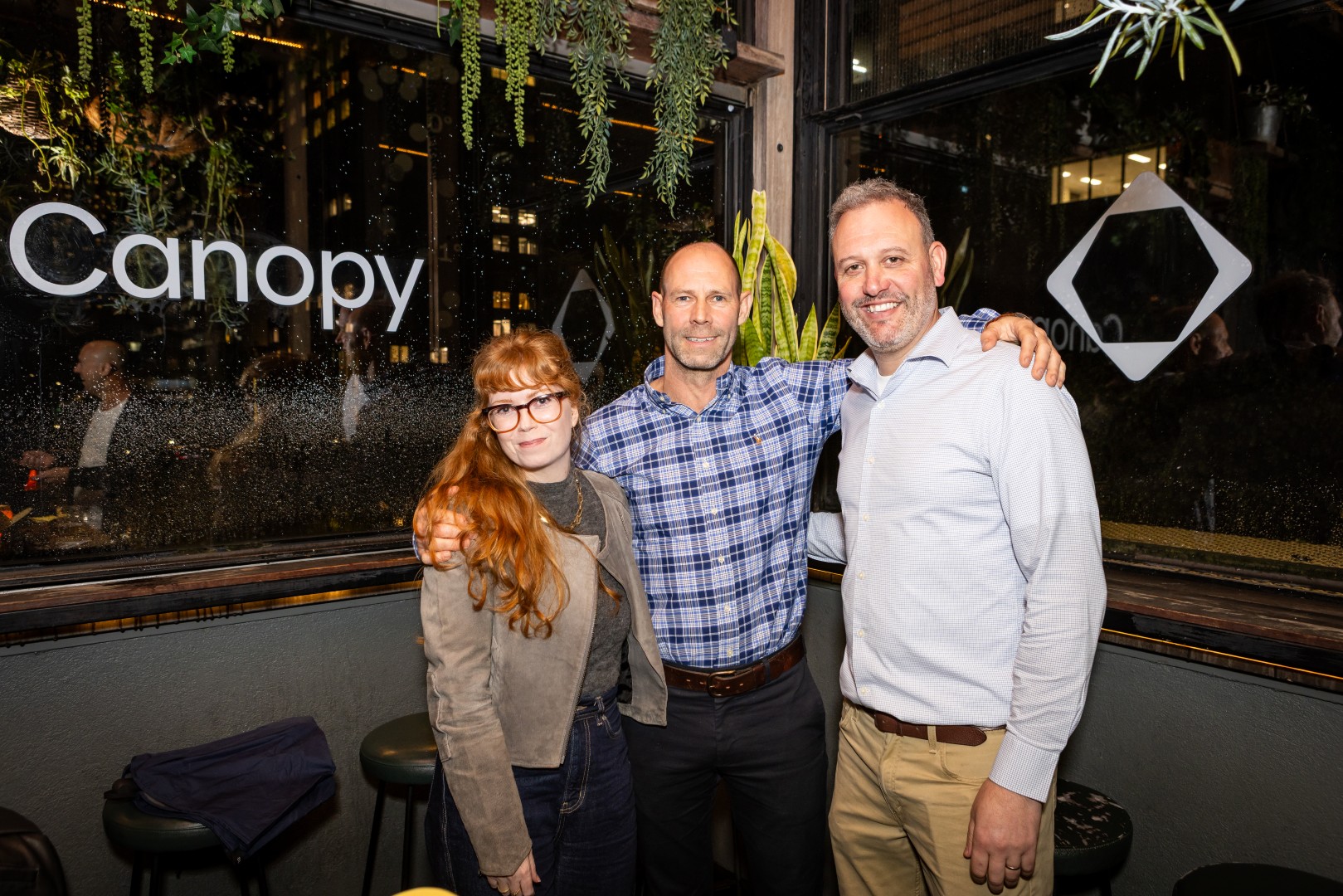 Guests in front of the Canopy logo window at the Canopy launch, Bomba Rooftop Bar, Melbourne