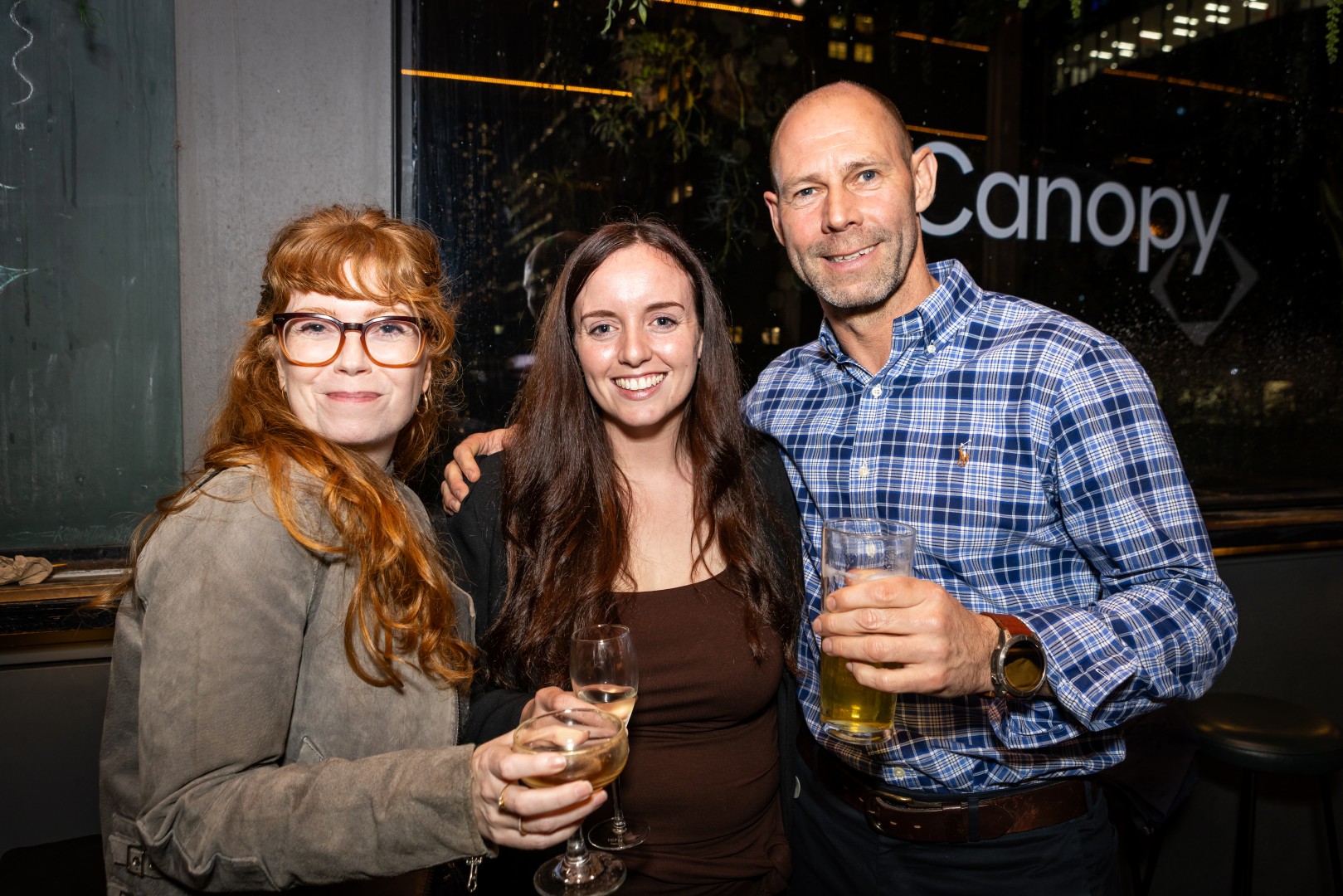 Guests in front of the Canopy logo window at the Canopy launch, Bomba Rooftop Bar, Melbourne