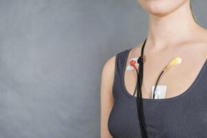A Heartscope technician fitting a Holter monitor