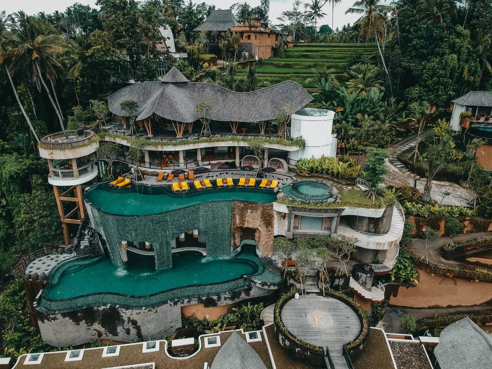 Aerial view of Kenran Resort Ubud surrounded by jungle greenery