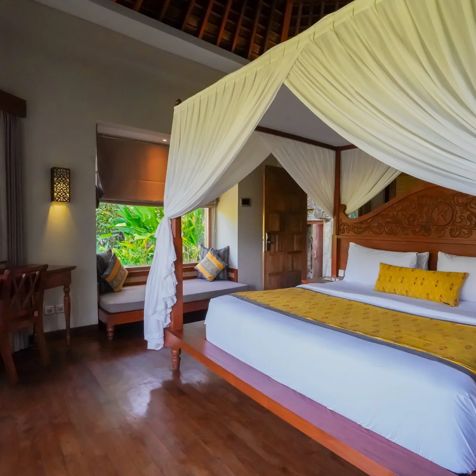 Kenran bedroom with carved wood bed