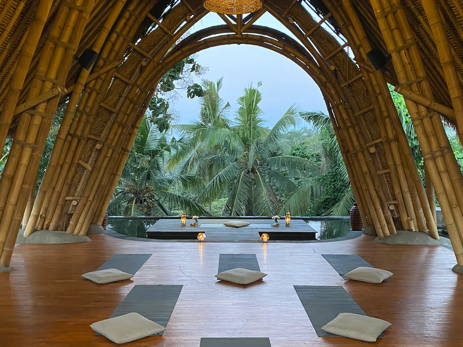 Bamboo event pavilion facing the forest