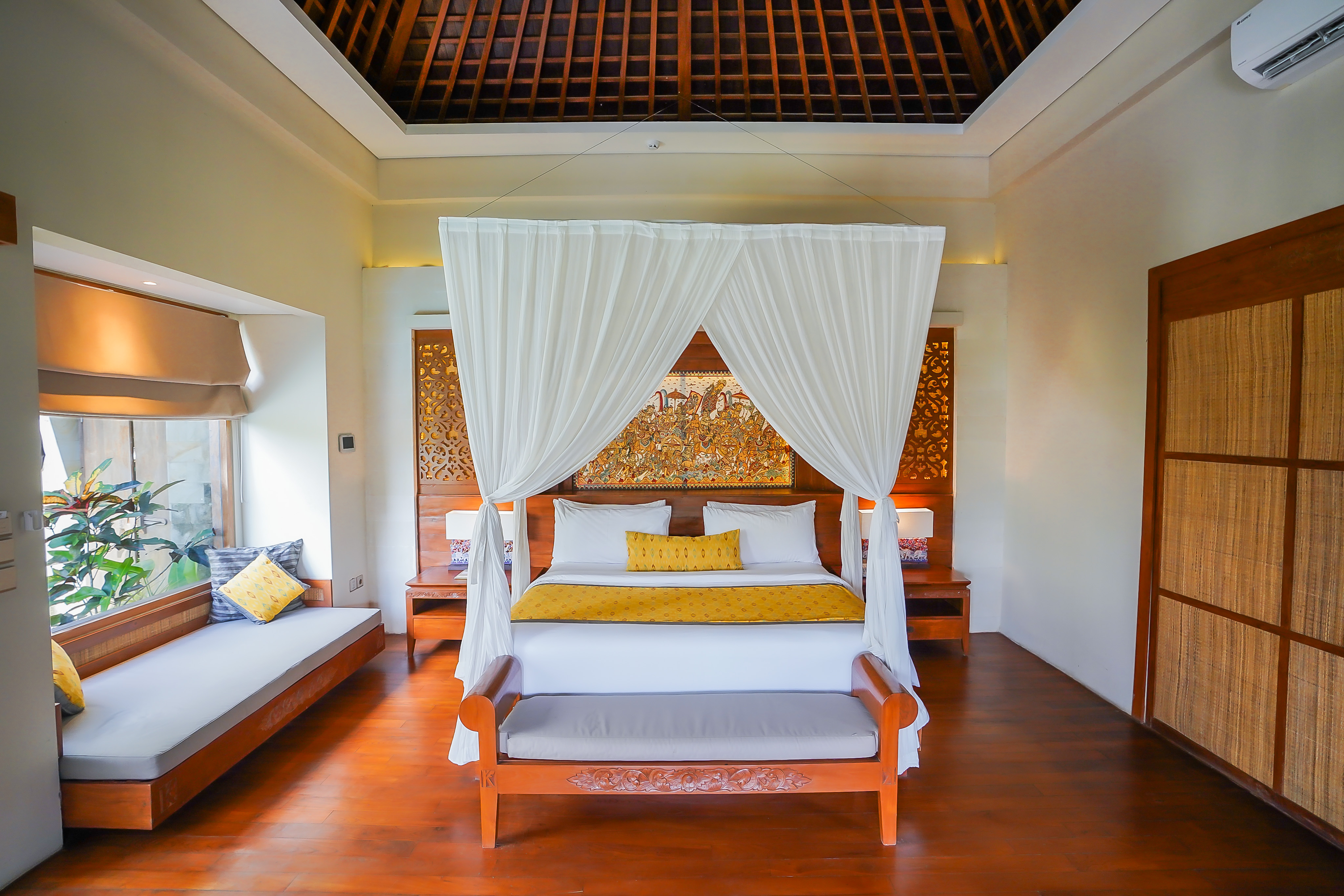 Guest room overlooking tropical greenery