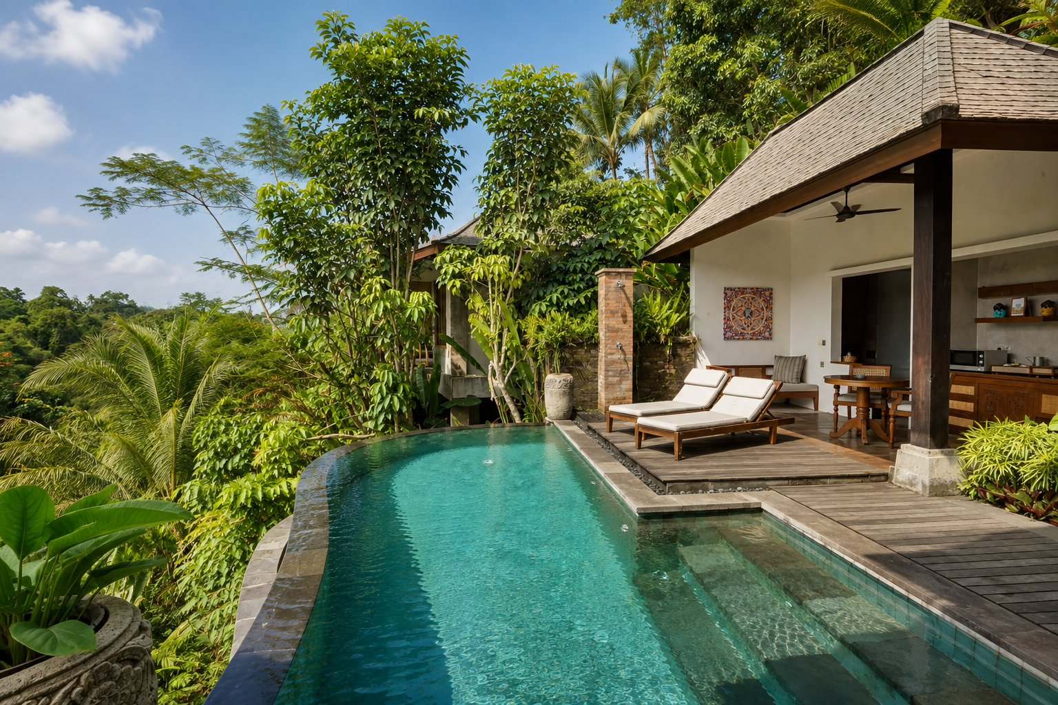 A Kenran suite balcony looking out over the jungle canopy at Ubud