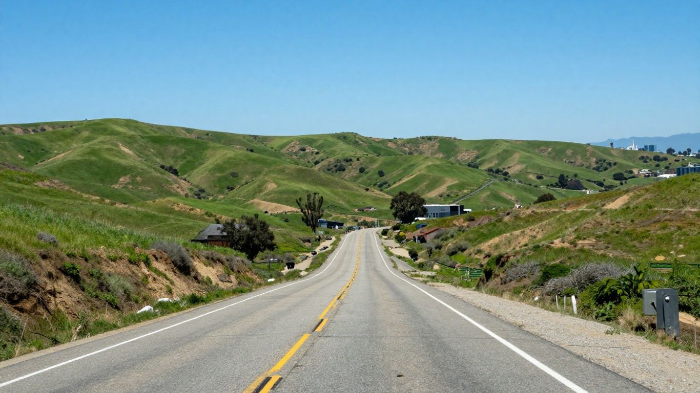 California landscape with road and city skyline.