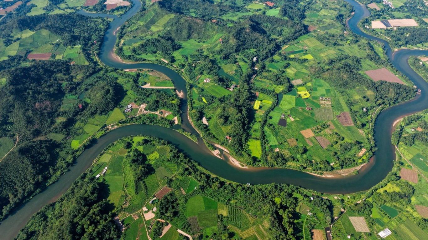 Aerial view of a watershed with rivers and green landscapes.